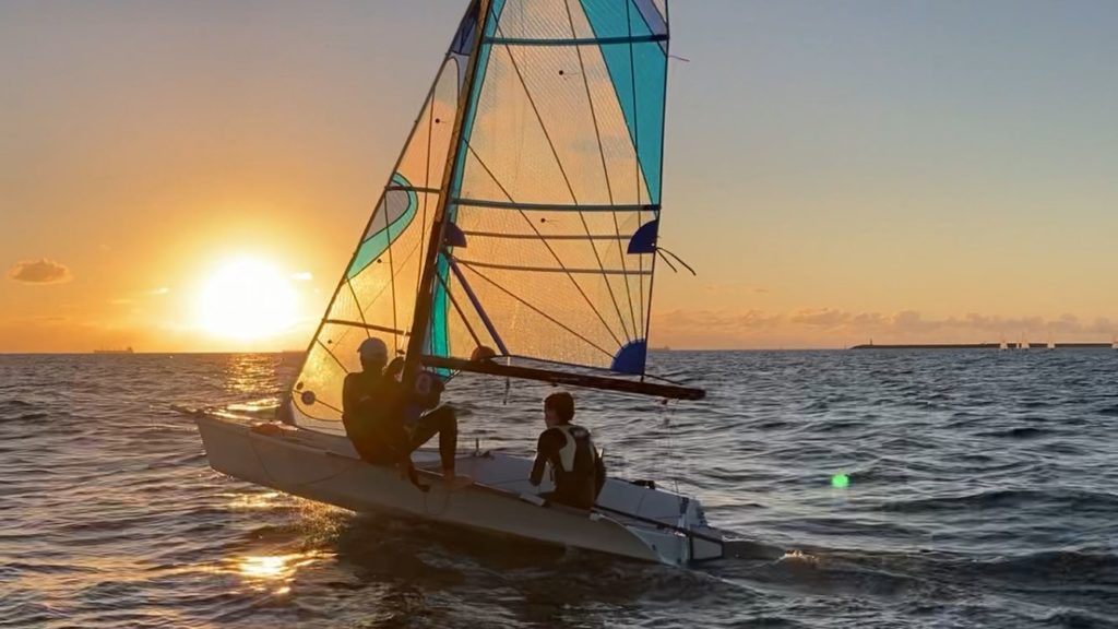 Two sailors sailing at sunset off fremantle